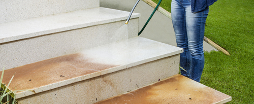 Man cleaning stairs using Power Jet